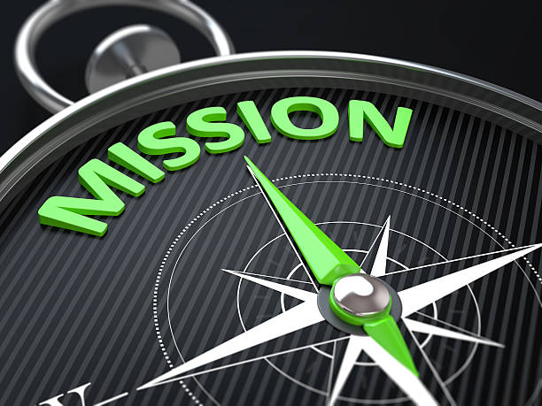 3d render image. compass needle pointing the green word mission.
